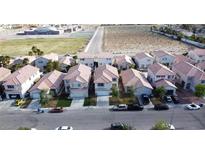 A high-angle view captures a neighborhood with neatly arranged homes and a mix of earth-toned roofs at 8901 Kingswood Dr, Las Vegas, NV 89147