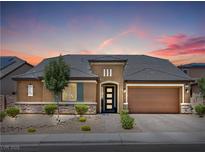 Charming single-story home featuring a well-manicured front yard and a spacious two-car garage at 9015 Chopper Prairie St, Las Vegas, NV 89131