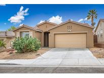 Charming single-story home featuring desert landscaping, a two-car garage, and a well-maintained front yard at 10513 Shanna Trellis Ave, Las Vegas, NV 89144