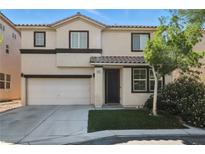 Charming two-story home with a well-manicured lawn and inviting curb appeal at 135 Cadrow Castle Ct, Las Vegas, NV 89148