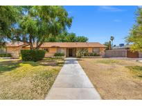 Charming single-story home with a well-maintained lawn and mature trees in a desirable neighborhood at 1911 Valley Dr, Las Vegas, NV 89108