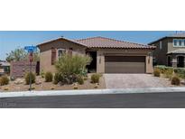 Charming single-story home with a well-maintained desert landscape and a two-car garage at 3012 Chiefs Ct, North Las Vegas, NV 89032