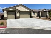 Beautiful single-story home with a spacious driveway and attached two-car garage at 31 White Burch Ln, Pahrump, NV 89048