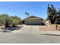 Charming single-story home with a well-maintained front yard and attached two-car garage at 3585 Winner Dr, Las Vegas, NV 89120