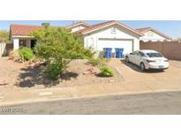 Charming one-story home with a well-kept yard and a lovely, red-tile roof in a sunny neighborhood at 410 Richgold St, Henderson, NV 89012