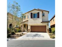 Charming two-story home with a well-maintained front yard and attached two car garage at , Las Vegas, NV 89179