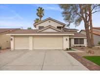 Charming two-story home with a three car garage and desert landscaping at 2344 Valleywood St, Henderson, NV 89014