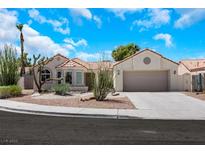 Charming single-story home with desert landscaping, tile roof, and a two-car garage at 2860 Misty Ct, Henderson, NV 89074