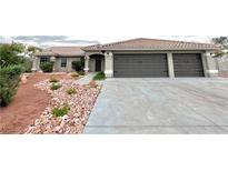 Charming single-story home with a three-car garage and well-maintained landscaping at 308 Cannes St, Henderson, NV 89015