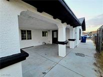 Wide carport featuring white columns with black trim, providing ample covered parking and curb appeal at 3215 Dillon Ave, North Las Vegas, NV 89030