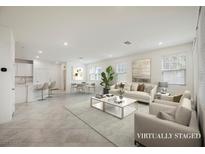 Bright, open-concept living room featuring modern decor and neutral tones at 3270 Trabia Ave, Henderson, NV 89044