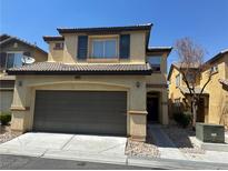 Charming two-story home with a spacious garage, neutral paint, and well-maintained landscaping at 4440 Acropolis Ave, North Las Vegas, NV 89031