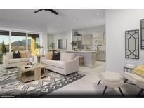 Inviting living room with modern decor, neutral tones, and an open layout leading to the kitchen at 4720 Tindra Ave # Lot 16, Las Vegas, NV 89121