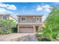 Charming two-story home with a large two-car garage and beautiful desert landscaping at 5234 Tulip Hill Ave, Las Vegas, NV 89141