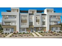 Modern townhouse exterior featuring multiple levels, clean lines, and contemporary design at 650 Agate Bridge St, Las Vegas, NV 89138