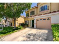Inviting two-story townhome featuring a charming balcony and well-manicured landscaping at 6533 Sundown Heights Ave, Las Vegas, NV 89130