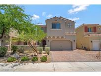 Charming two-story home with a paver driveway and low-maintenance desert landscaping at 1000 Cetona Ct, Henderson, NV 89011