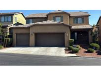 Charming two-story home featuring a three-car garage and well-manicured landscaping at 10668 Berkshire Woods Ave, Las Vegas, NV 89166