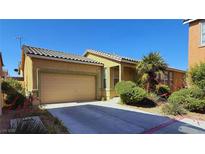 Charming single-story home with desert landscaping and a two-car garage at 2613 Calico Hearts Ct, Las Vegas, NV 89106