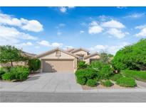 Charming single-story home with a well-maintained front yard and a two-car garage at 412 Carlton Kay Pl, Las Vegas, NV 89144