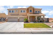 Charming two-story home featuring a three-car garage and well-maintained landscaping at 6209 Exquisite Ave, Las Vegas, NV 89110