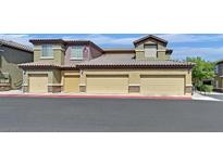 Attractive condo building featuring multiple attached garages in a well-maintained community at 6868 Sky Pointe Dr # 1107, Las Vegas, NV 89131