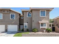 Charming townhome featuring a two-car garage and well-manicured front yard, perfect for comfortable living at 9270 Apache Springs Dr, Las Vegas, NV 89117