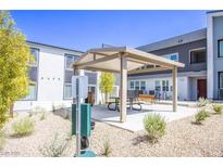 A community picnic area offers residents a shady place to sit and relax outdoors at 139 Aqua Commons Ln, Henderson, NV 89015