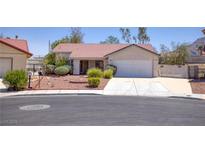 Charming single-story home with a well-maintained front yard and an attached two-car garage at 1590 Desertaire Way, Las Vegas, NV 89110