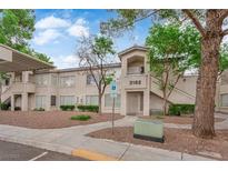 Inviting condo building with well-maintained landscaping, accessible parking, and charming exterior details at 3182 Tarpon Dr # 204, Las Vegas, NV 89120