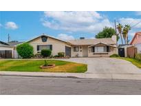 Charming single story home featuring a tile roof and a well-maintained front yard at 3499 Middlebury Ave, Las Vegas, NV 89121