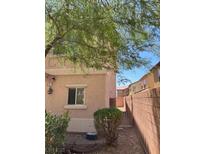 Charming home exterior featuring neutral stucco, manicured landscaping, and an inviting facade at 8355 Pearl Beach Ct, Las Vegas, NV 89139
