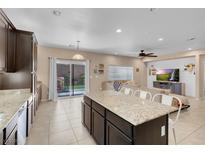 Bright kitchen featuring granite countertops, stainless appliances and open floor plan at 10135 Haymarket Peak Ave, Las Vegas, NV 89166