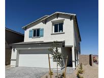 Charming two-story home featuring a two car garage and a well-maintained yard with blue shutters at 10442 Luna Mezza Ave # Lot 187, Las Vegas, NV 89141