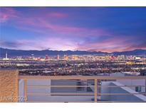 Enjoy panoramic city views from the balcony of this home at 11676 Midnight Melody Ave, Las Vegas, NV 89138