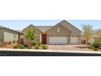 Charming single-story home with stone accents, three-car garage, and well-manicured front yard at 3391 Stone View Ave, Henderson, NV 89044