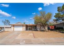 Charming single-story home featuring a xeriscaped front yard and attached two-car garage at 405 Box Elder Way, Henderson, NV 89015