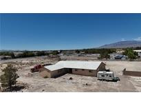 Spacious single-story home with a large yard, RV parking, and mountain views at 7130 Bilpar Rd, Las Vegas, NV 89131