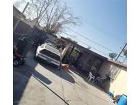 The backyard has a car and a place to sit at 2315 Perliter Ave, North Las Vegas, NV 89030