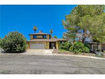 Two-story home features a two-car garage and desert landscaping at 4280 Cicada Way, Las Vegas, NV 89121