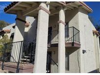 Attractive two-story condo exterior with well-maintained stucco and covered stairways at 4451 Rich Dr # D, Las Vegas, NV 89102