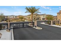 Community gated entrance showing the secure and upscale neighborhood with beautiful homes and landscaping at 7432 Red Plumeria Ave, Las Vegas, NV 89113