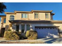 Charming two-story home featuring an attached garage and well-maintained landscaping at 7728 Villa De La Paz Ave, Las Vegas, NV 89131