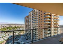 Stunning views from the private balcony of the high-rise condo showcase the cityscape and mountain views at 8255 Las Vegas S Blvd # 1414, Las Vegas, NV 89123