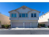 Charming two-story townhouse with three-car garage and desert landscaping at 8843 Tomnitz Ave # 102, Las Vegas, NV 89178
