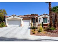 Charming single-story home featuring a three-car garage, desert landscaping, and tile roof at 11240 Romette Ct, Las Vegas, NV 89141