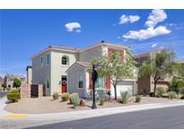 Charming two-story home with red shutters, a red front door, and low-maintenance desert landscaping at 1172 Strada Pecei, Henderson, NV 89011