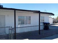 Cozy single-story home featuring a fenced front yard and covered porch at 1316 Lawry Ave, Las Vegas, NV 89106