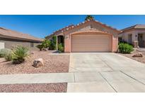 Charming single-story home showcasing a well-kept yard and attached two-car garage at 2101 High Mesa Dr, Henderson, NV 89012