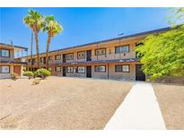 Apartment building featuring a central courtyard with mature palm trees and walkways at 3720 Royal Crest St # 6, Las Vegas, NV 89119